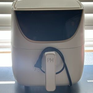 Paris Hilton Cream and Black Electronic Appliance